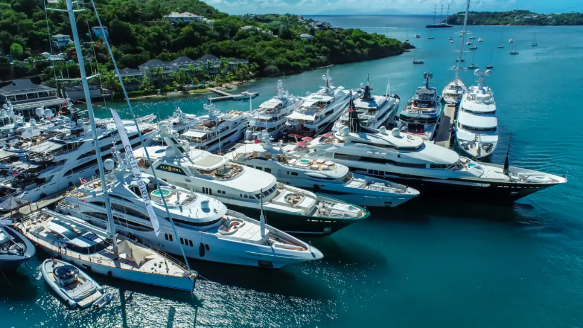 Close aerial view of superyachts stern-to at the marina